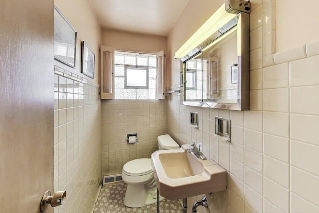 1927 Herbert Ave, Berkeley, IL 60163 - bathroom with tile walls, tile patterned floors, and a wainscoted wall