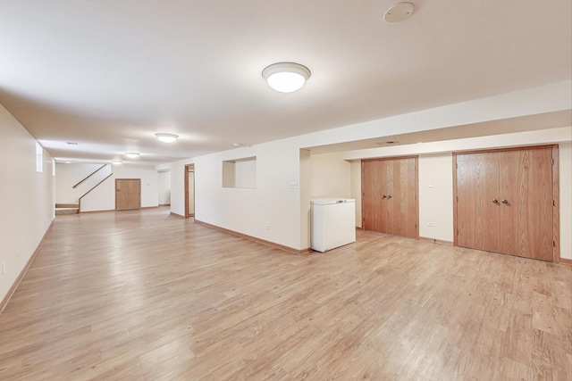 1927 Herbert Ave, Berkeley, IL 60163 - unfurnished living room with light wood-style flooring and stairway