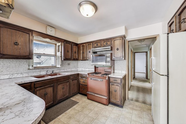 1927 Herbert Ave, Berkeley, IL 60163 - kitchen featuring white appliances, light countertops, tasteful backsplash, and light tile patterned floors