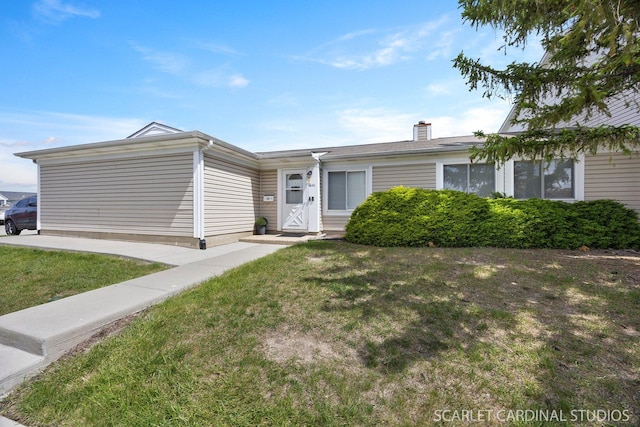 1641 Cornell Dr, Hoffman Estates, IL 60169 - single story home featuring a front lawn and a chimney