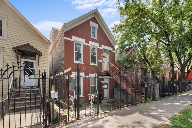 2649 W 21st Pl, Chicago, IL 60608 - view of front of house featuring a fenced front yard, a gate, and brick siding