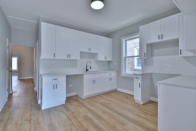 8004 S Ada St, Chicago, IL 60620 - kitchen with light wood-style floors, backsplash, and plenty of natural light