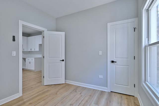 8004 S Ada St, Chicago, IL 60620 - unfurnished bedroom with light wood-style floors