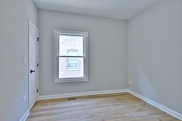 8004 S Ada St, Chicago, IL 60620 - unfurnished room with light wood finished floors and baseboards