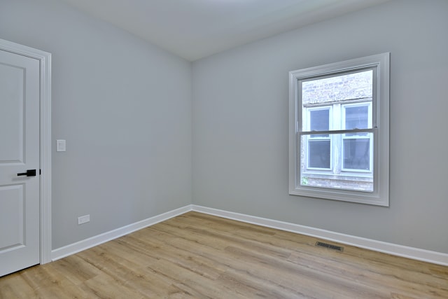 8004 S Ada St, Chicago, IL 60620 - spare room featuring light wood-style flooring and baseboards