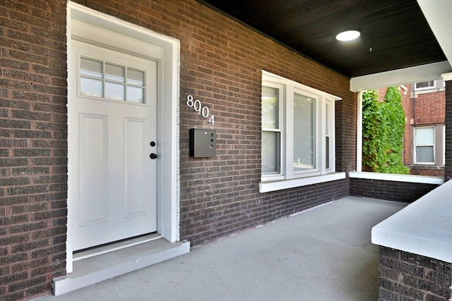 8004 S Ada St, Chicago, IL 60620 - entrance to property featuring a porch and brick siding