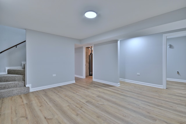 8004 S Ada St, Chicago, IL 60620 - finished basement featuring light wood-type flooring and stairway