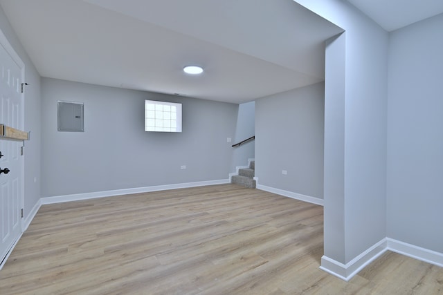 8004 S Ada St, Chicago, IL 60620 - below grade area with stairway, light wood-type flooring, and electric panel