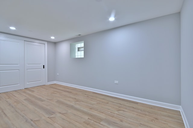 8004 S Ada St, Chicago, IL 60620 - unfurnished bedroom with light wood-style floors, recessed lighting, and a closet