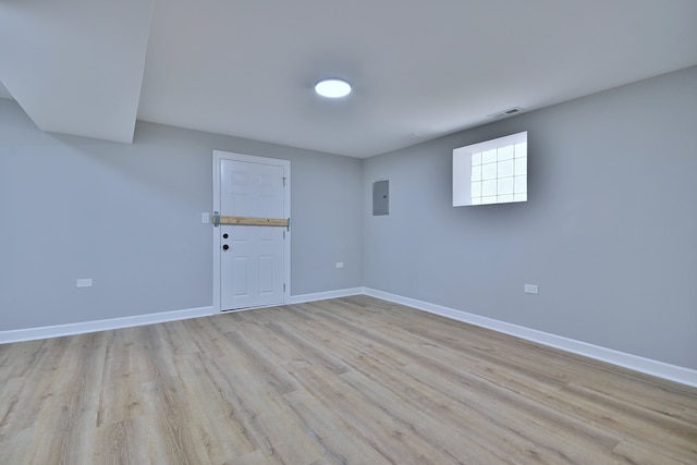 8004 S Ada St, Chicago, IL 60620 - below grade area with light wood-style floors and electric panel
