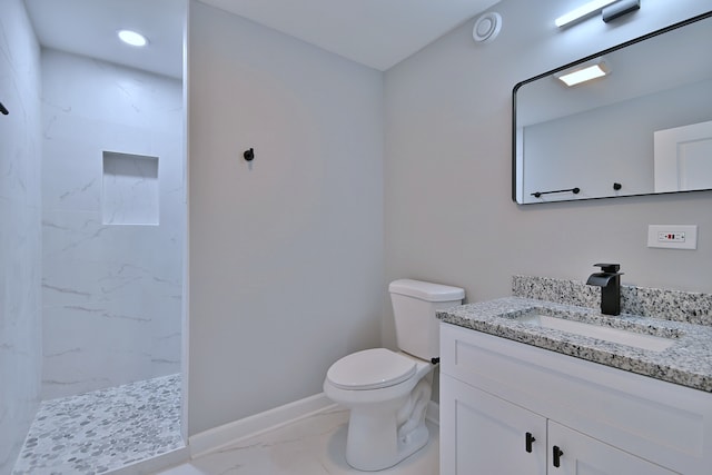 8004 S Ada St, Chicago, IL 60620 - bathroom featuring marble look tile flooring, vanity, a marble finish shower, and recessed lighting