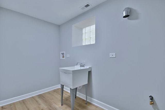 8004 S Ada St, Chicago, IL 60620 - laundry area with washer hookup and light wood-type flooring