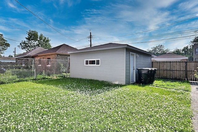 8004 S Ada St, Chicago, IL 60620 - rear view of house with a fenced backyard and an outbuilding