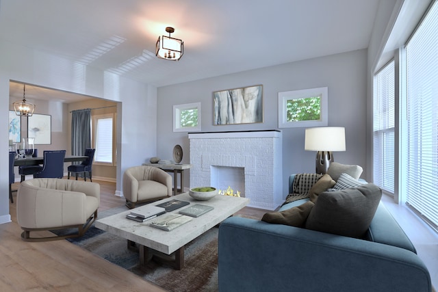 8004 S Ada St, Chicago, IL 60620 - living area featuring wood finished floors, a chandelier, and a brick fireplace