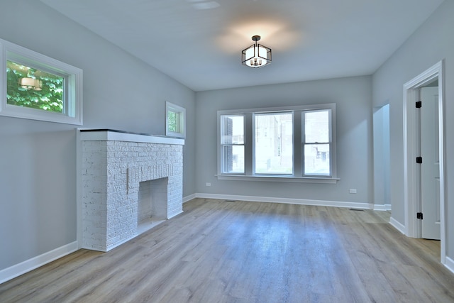 8004 S Ada St, Chicago, IL 60620 - unfurnished living room with wood finished floors and a fireplace