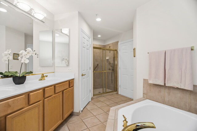 2660 Summit Dr Unit 302, Glenview, IL 60025 - full bath featuring a stall shower, double vanity, tile patterned floors, a garden tub, and recessed lighting