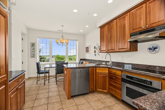 2660 Summit Dr Unit 302, Glenview, IL 60025 - kitchen featuring stainless steel appliances, under cabinet range hood, a chandelier, brown cabinetry, and recessed lighting