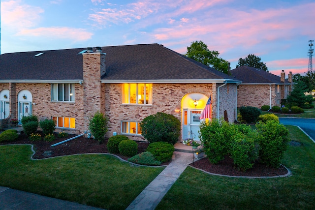 15317 S 73rd Ave Unit 8, Orland Park, IL 60462 - view of front facade with a front lawn, a chimney, roof with shingles, and brick siding