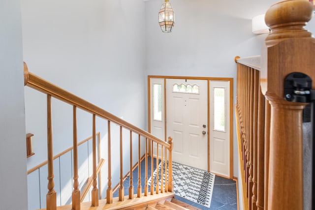 15317 S 73rd Ave Unit 8, Orland Park, IL 60462 - entryway featuring stairs, a towering ceiling, and stone finish floors