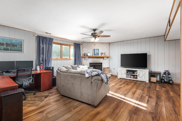 15317 S 73rd Ave Unit 8, Orland Park, IL 60462 - living room featuring ceiling fan, wood finished floors, an office area, a brick fireplace, and crown molding