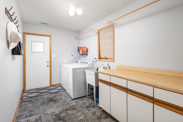 15317 S 73rd Ave Unit 8, Orland Park, IL 60462 - laundry area featuring washing machine and clothes dryer, cabinet space, and stone finish floors