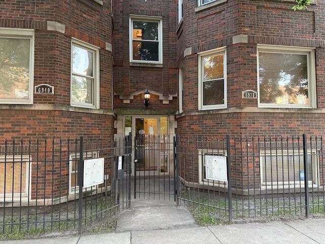 6938 S Dorchester Ave Unit 2, Chicago, IL 60637 - property entrance with brick siding and a gate