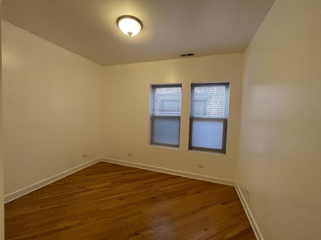 6938 S Dorchester Ave Unit 2, Chicago, IL 60637 - spare room featuring dark wood finished floors and baseboards