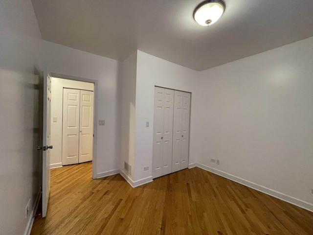 6938 S Dorchester Ave Unit 2, Chicago, IL 60637 - unfurnished bedroom featuring wood finished floors and a closet