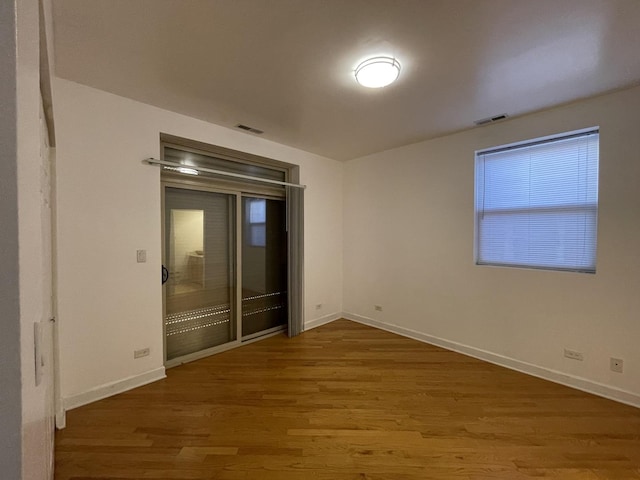 6938 S Dorchester Ave Unit 2, Chicago, IL 60637 - spare room with wood finished floors and plenty of natural light