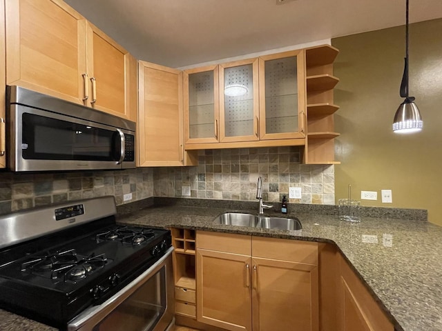 6938 S Dorchester Ave Unit 2, Chicago, IL 60637 - kitchen featuring appliances with stainless steel finishes, open shelves, tasteful backsplash, and dark stone countertops