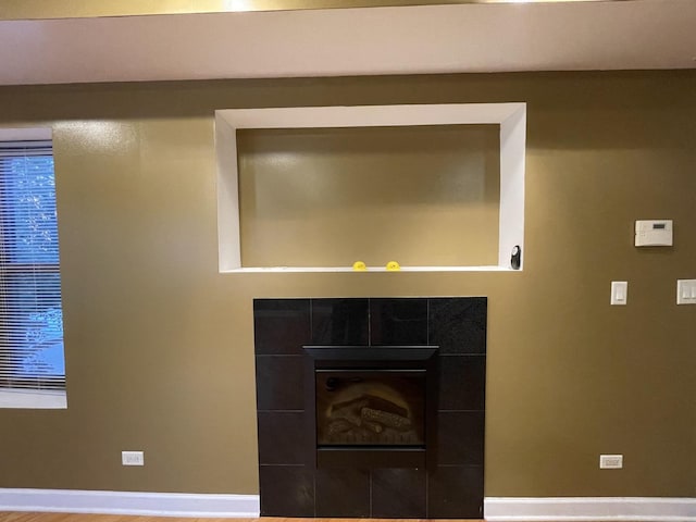 6938 S Dorchester Ave Unit 2, Chicago, IL 60637 - detailed view of baseboards and a tiled fireplace