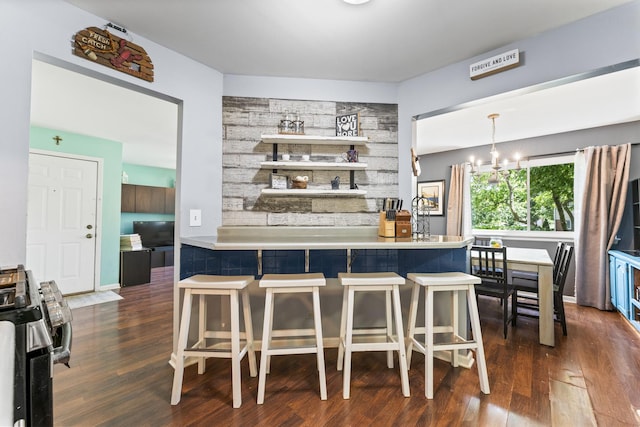 1400 Ashton Ct Unit B1, Wheeling, IL 60090 - bar area featuring stainless steel range, dark wood-style floors, and a chandelier