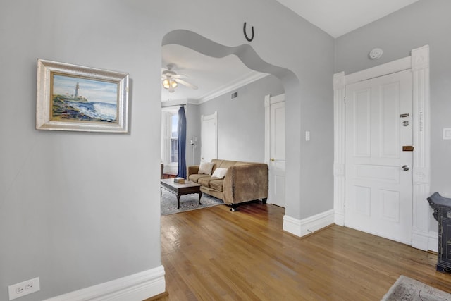1848 W Cermak Rd Unit 3, Chicago, IL 60608 - foyer featuring ceiling fan, wood finished floors, arched walkways, and ornamental molding