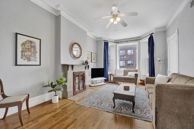 1848 W Cermak Rd Unit 3, Chicago, IL 60608 - living room with ornamental molding, ceiling fan, a fireplace with flush hearth, and wood finished floors
