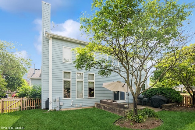 2467 Worthington Dr, Aurora, IL 60506 - rear view of property with a chimney and a patio area
