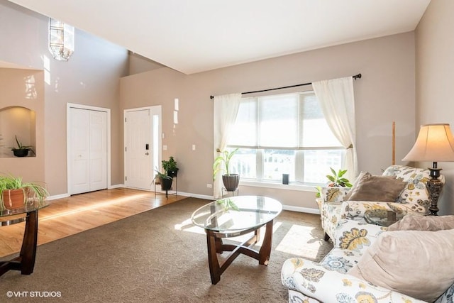 2467 Worthington Dr, Aurora, IL 60506 - carpeted living area featuring baseboards and wood finished floors