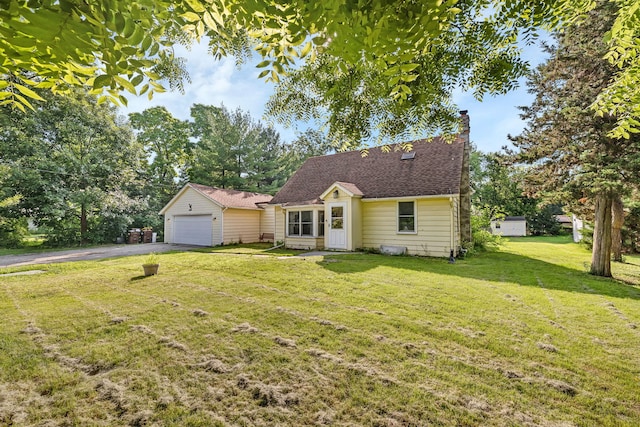 1819 Il Route 176, Crystal Lake, IL 60014 - view of front of house with a chimney, an outbuilding, a front yard, and asphalt driveway