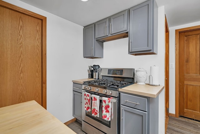 1819 Il Route 176, Crystal Lake, IL 60014 - kitchen featuring gas range, gray cabinetry, light countertops, and wood finished floors