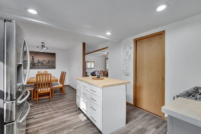 1819 Il Route 176, Crystal Lake, IL 60014 - kitchen featuring stainless steel refrigerator with ice dispenser, light countertops, light wood-style flooring, white cabinetry, and recessed lighting