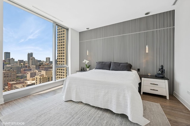403 N Wabash Ave Unit 17C, Chicago, IL 60611 - bedroom featuring wood finished floors and a city view