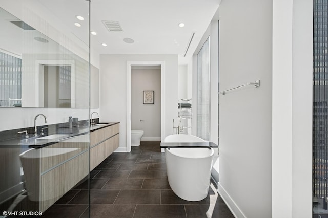 403 N Wabash Ave Unit 17C, Chicago, IL 60611 - full bath featuring a soaking tub, double vanity, recessed lighting, and tile patterned floors