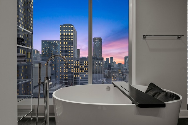 403 N Wabash Ave Unit 17C, Chicago, IL 60611 - bathroom featuring a skyline view and a soaking tub