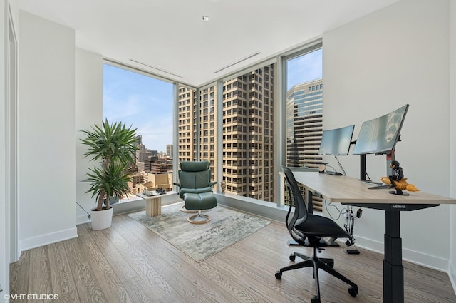 403 N Wabash Ave Unit 17C, Chicago, IL 60611 - office featuring expansive windows, plenty of natural light, wood finished floors, and a view of city