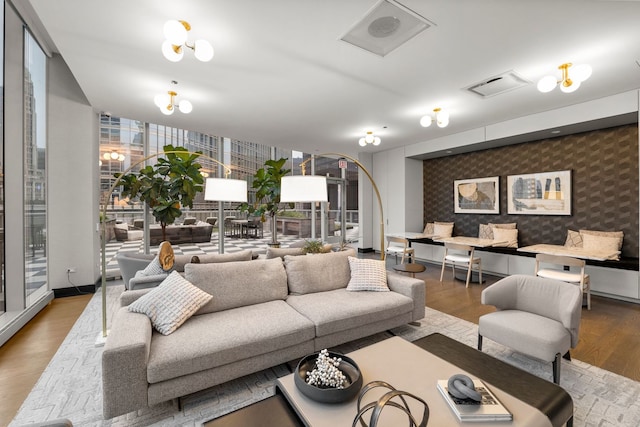 403 N Wabash Ave Unit 17C, Chicago, IL 60611 - living area with wallpapered walls, an accent wall, and wood finished floors