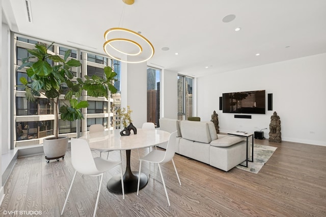 403 N Wabash Ave Unit 17C, Chicago, IL 60611 - dining room with wood finished floors, floor to ceiling windows, recessed lighting, and a chandelier