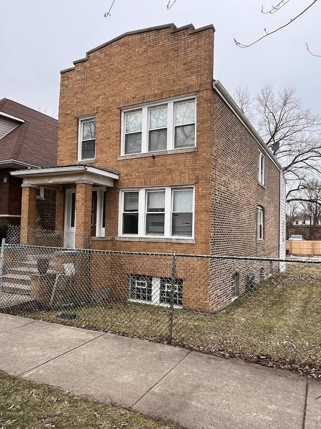 3654 E 97th St, Chicago, IL 60617 - view of front of house featuring brick siding and a fenced front yard