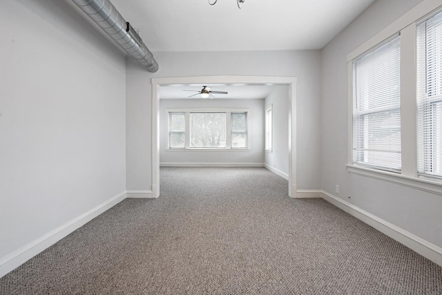 5043 W Argyle St, Chicago, IL 60630 - carpeted spare room featuring ceiling fan and baseboards
