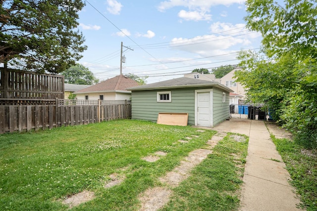 5043 W Argyle St, Chicago, IL 60630 - view of yard featuring a detached garage and an outbuilding