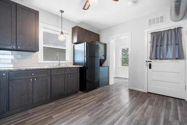 5043 W Argyle St, Chicago, IL 60630 - kitchen with freestanding refrigerator, ceiling fan, dark wood-style flooring, dark brown cabinetry, and decorative light fixtures