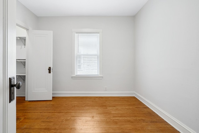5043 W Argyle St, Chicago, IL 60630 - unfurnished bedroom featuring light wood-style flooring, a walk in closet, and a closet